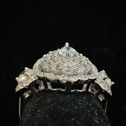A sterling silver ring set with marquise cut white sapphire stones in sterling silver.