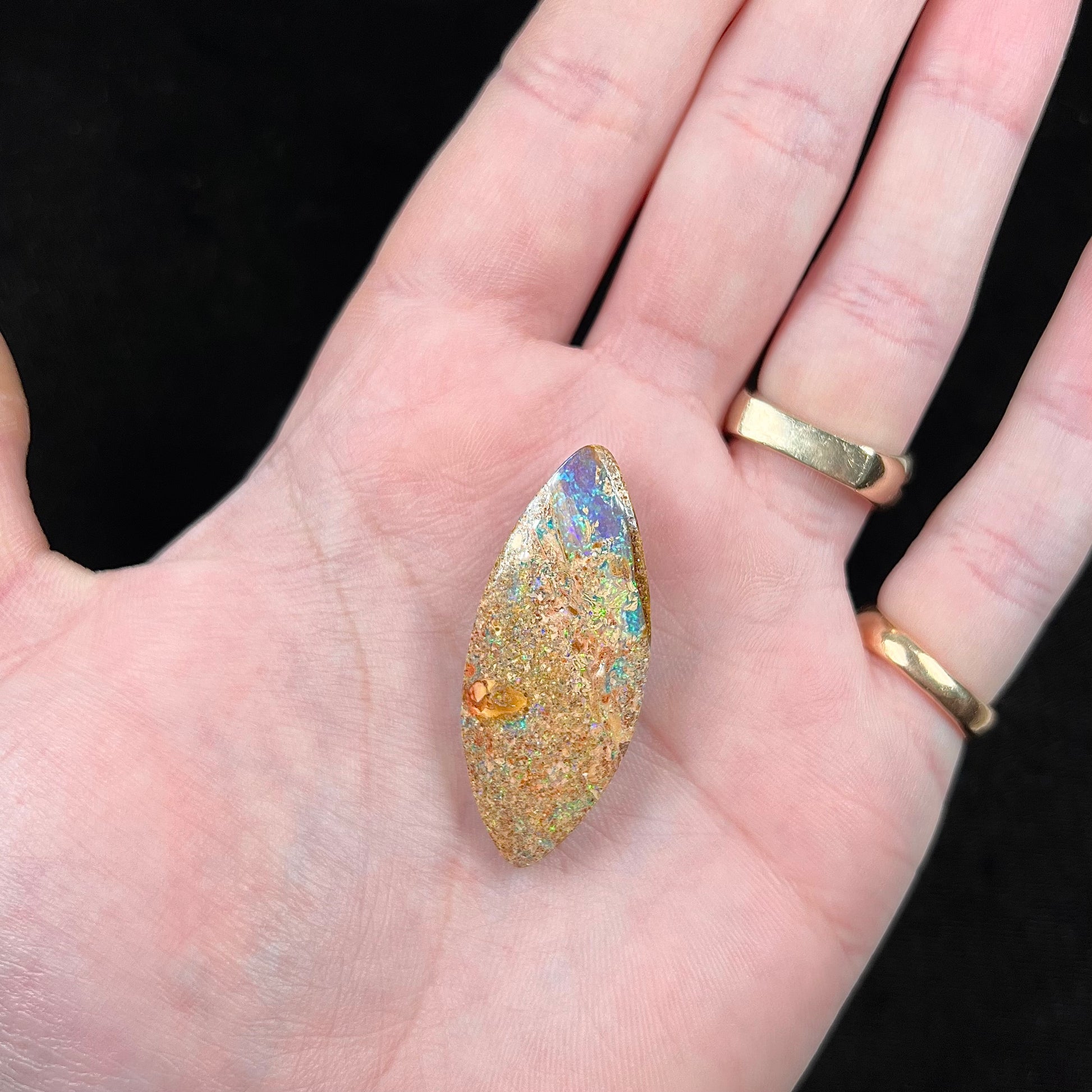 A polished, drilled pipe boulder opal bead.