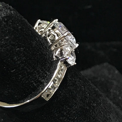 A sterling silver ring set with three round cut cubic zirconia stones.
