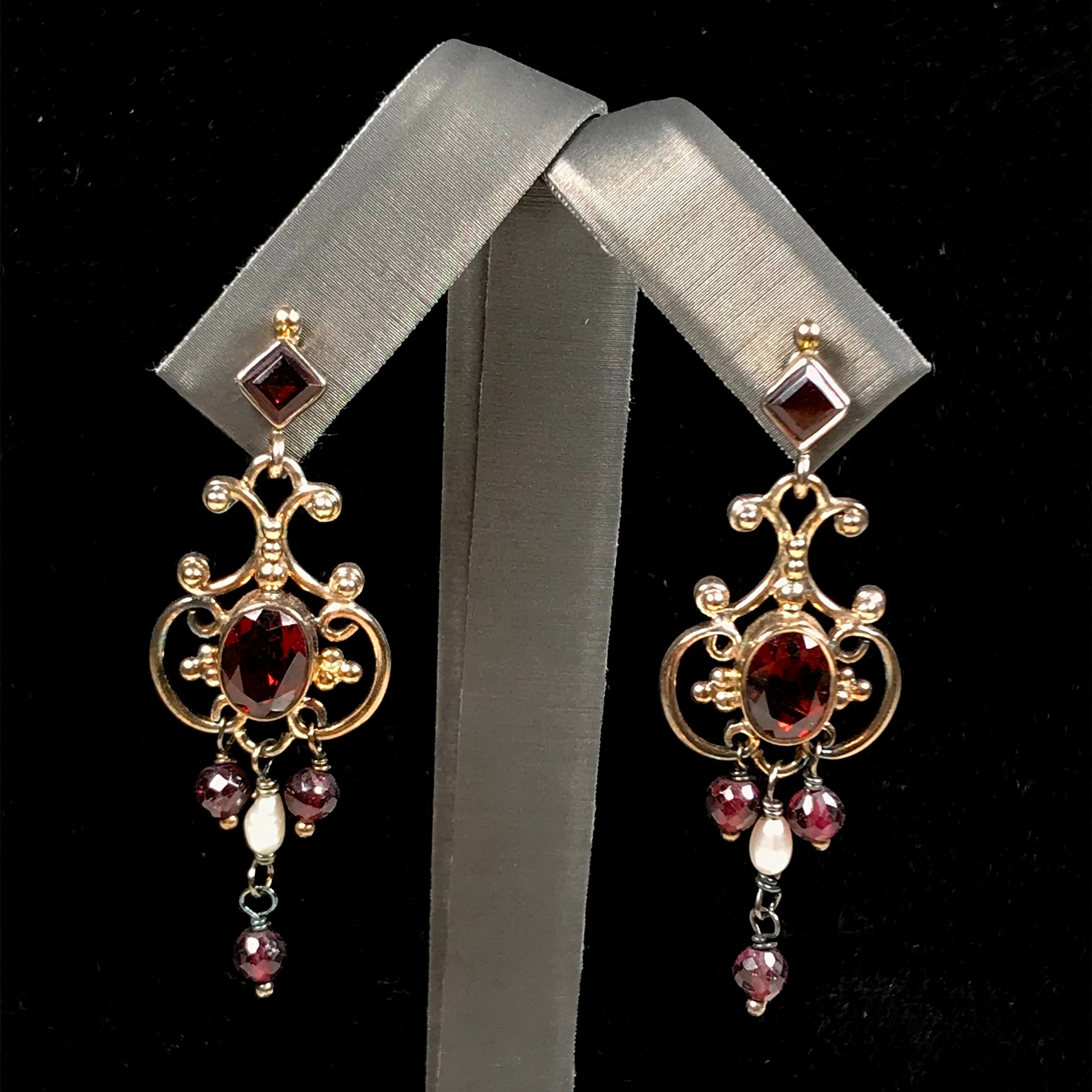 Garnet and pearl silver filigree dangle earrings with post backs.