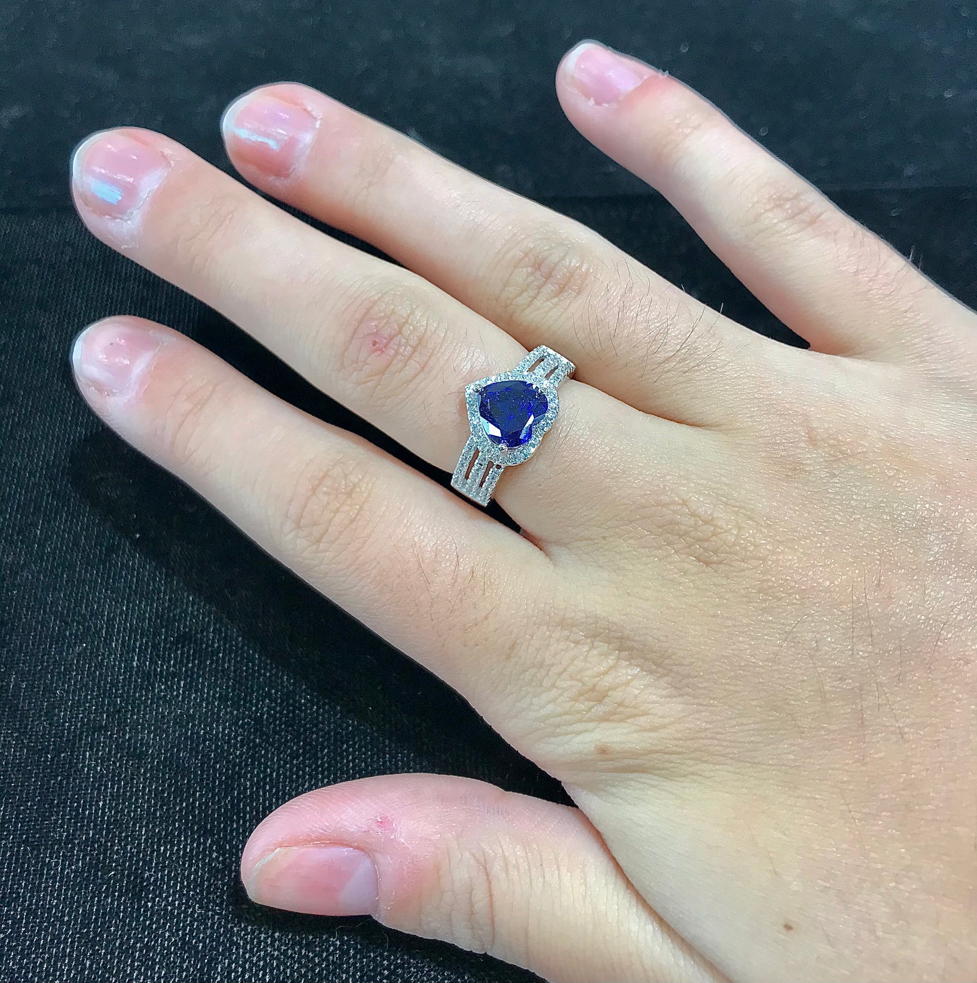 Synthetic blue heart shaped sterling silver ring.