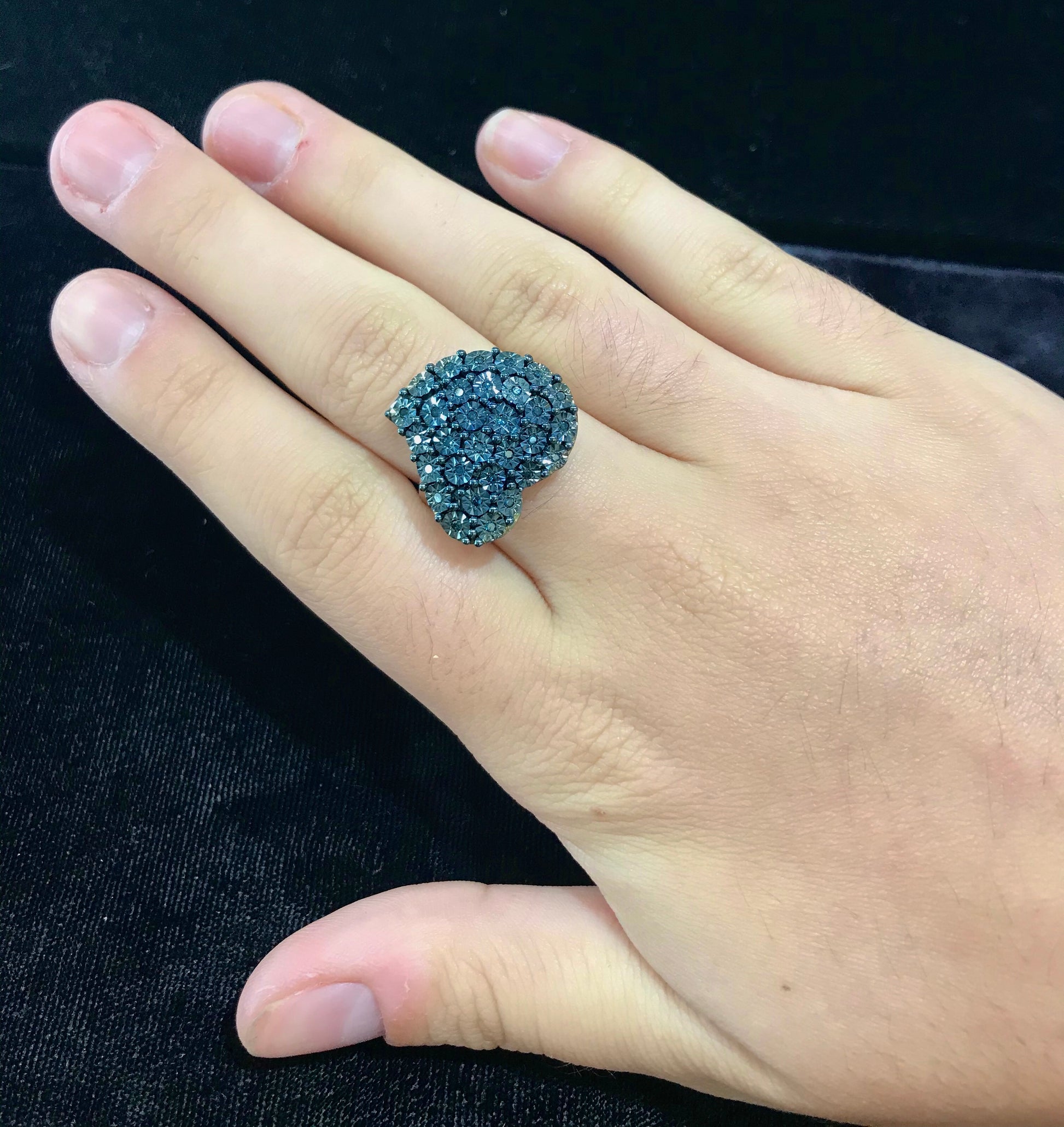 Blue diamond sterling silver heart shaped ring.