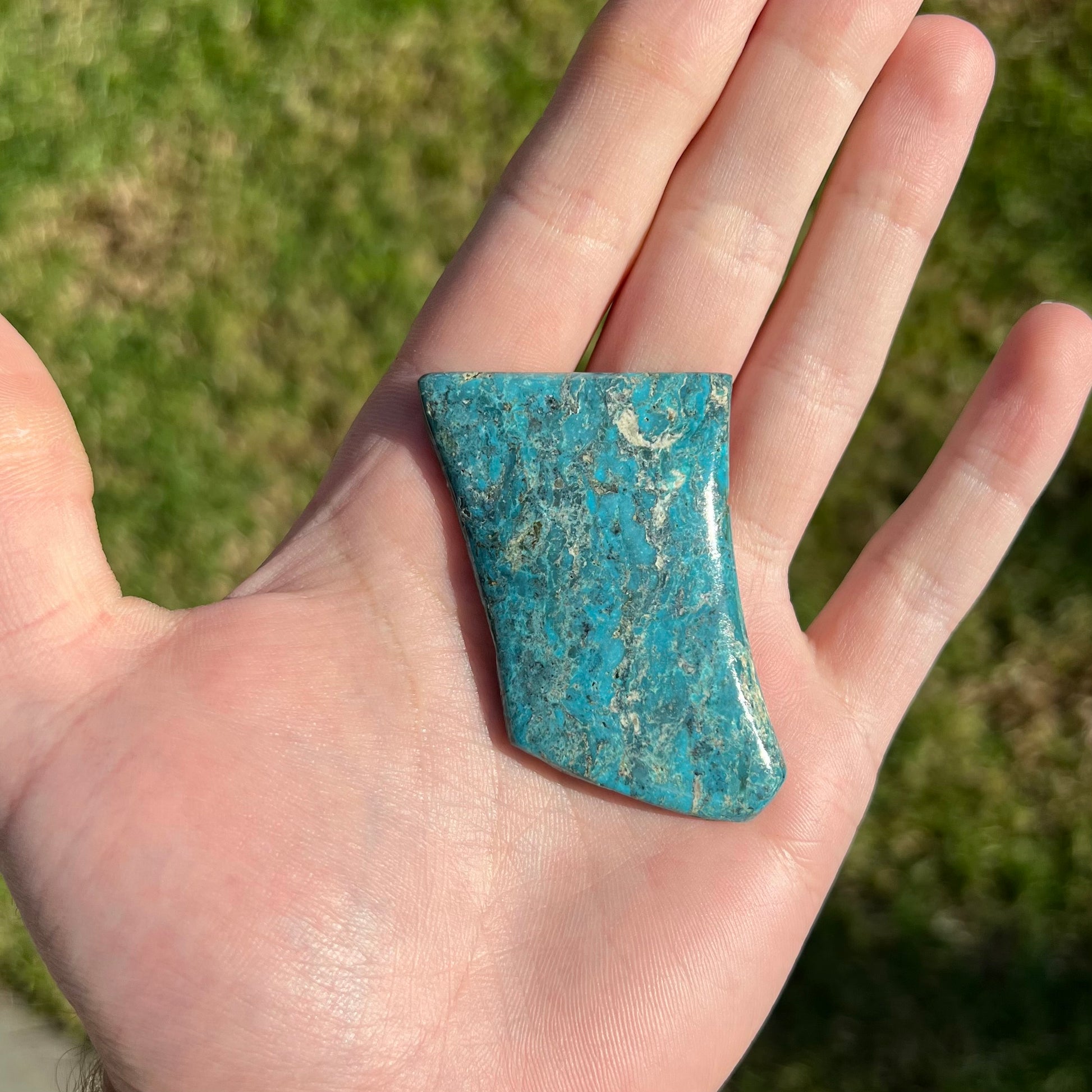 One loose semi-polished Stormy Mountain turquoise stone.