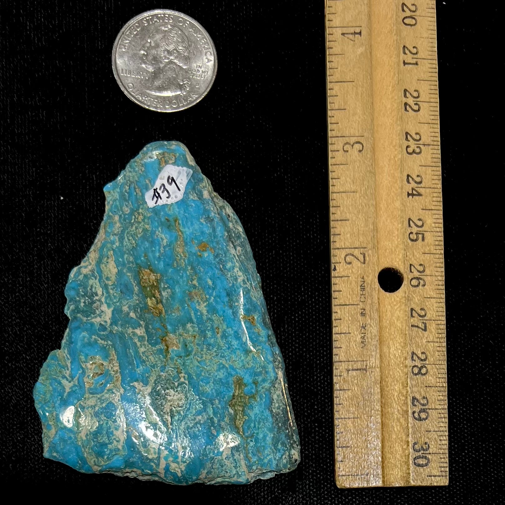 A loose semi-polished rough Sleeping Beauty turquoise stone.
