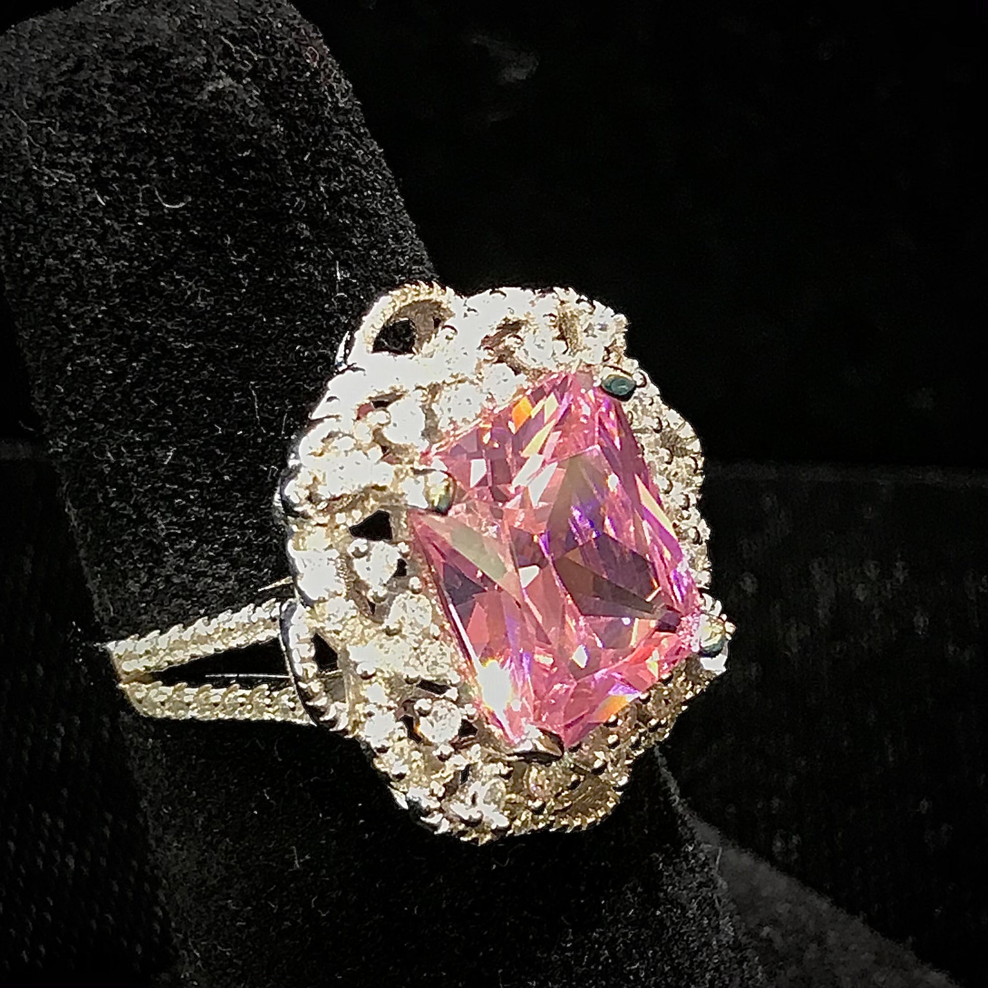 Pink synthetic gemstone ring set in sterling silver.