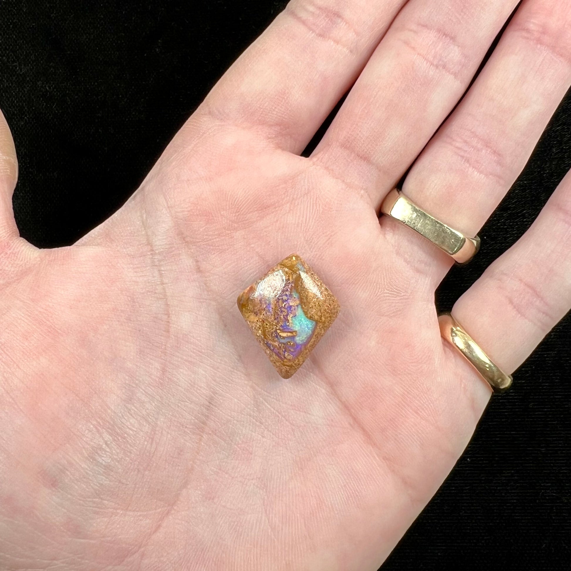 A polished, drilled pipe boulder opal bead.