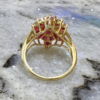 Burma ruby cluster ring set in 14 karat yellow gold.