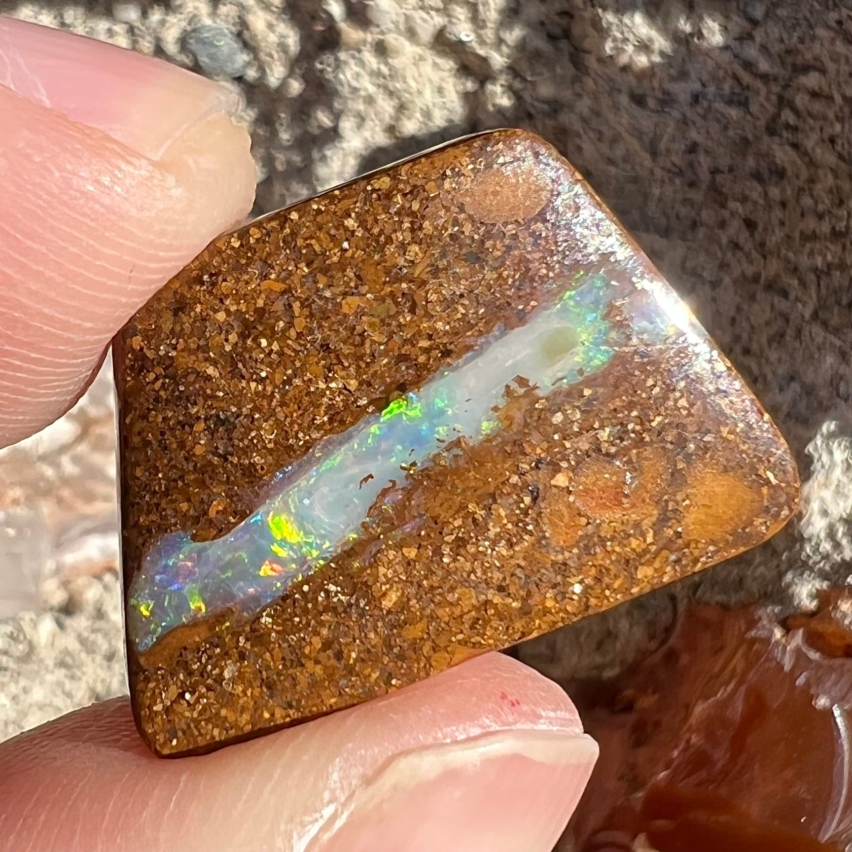 A polished, drilled pipe boulder opal bead.