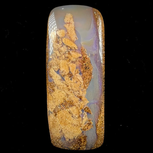 A polished, drilled pipe boulder opal bead.