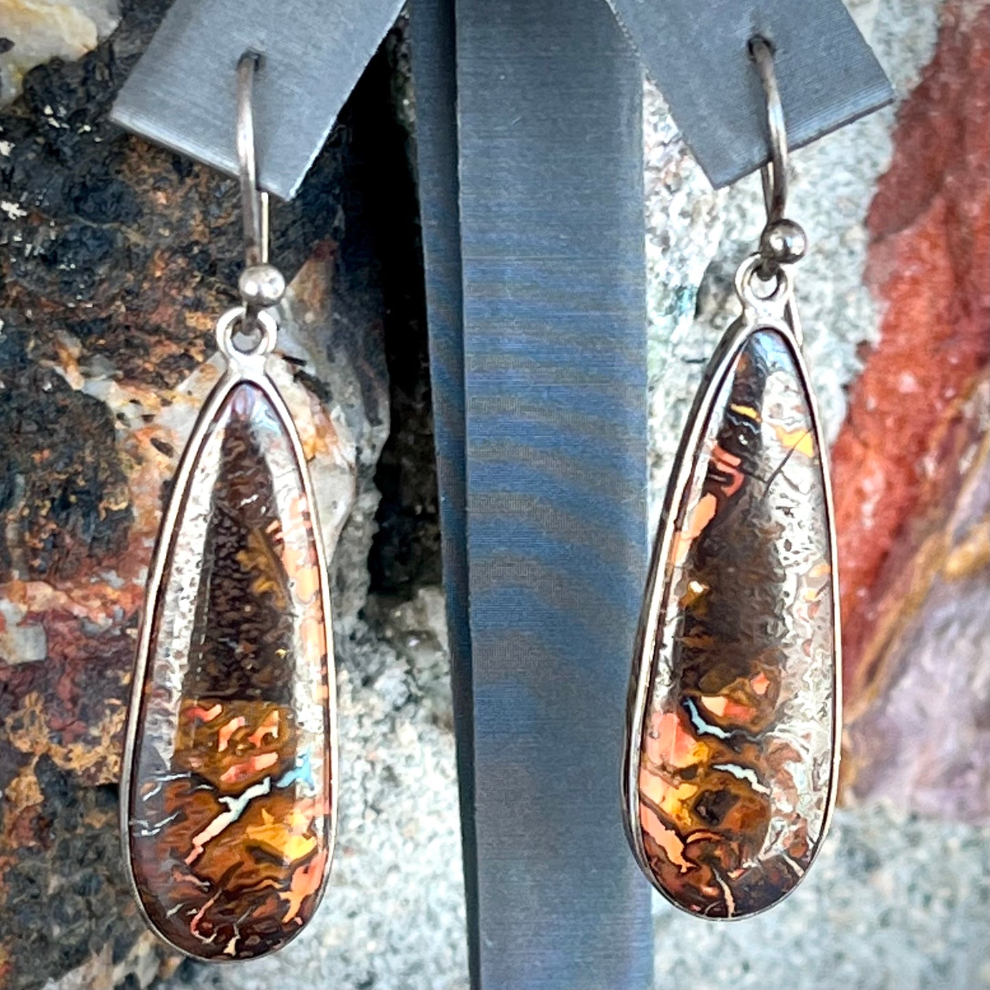 A pair of sterling silver boulder opal drop dangle earrings.