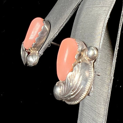 A pair of sterling silver coral earrings handmade by Zuni artists, Carmelita and Dan Simplicio.