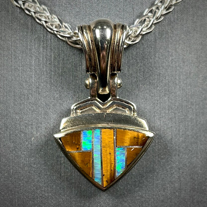 Tigers Eye and synthetic opal triangle inlay pendant set in sterling silver.