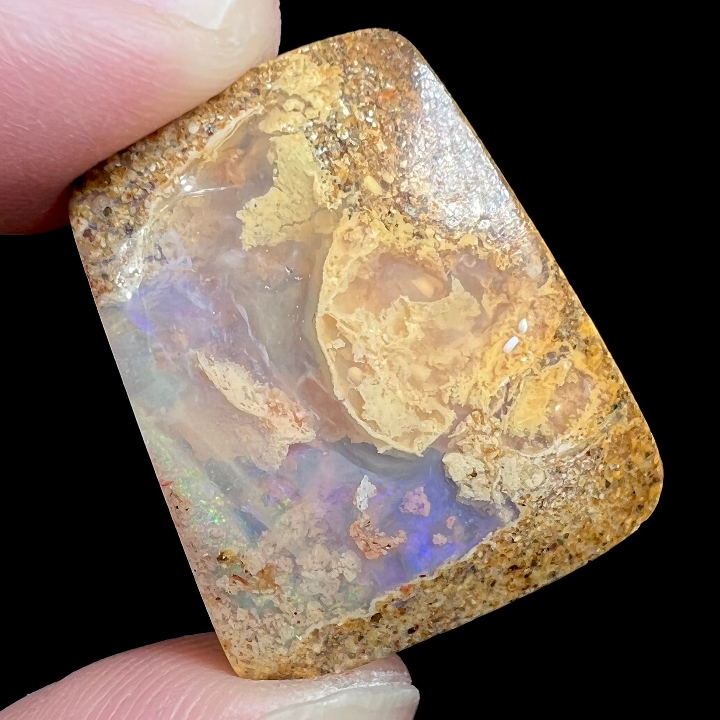 A polished, drilled pipe boulder opal bead.