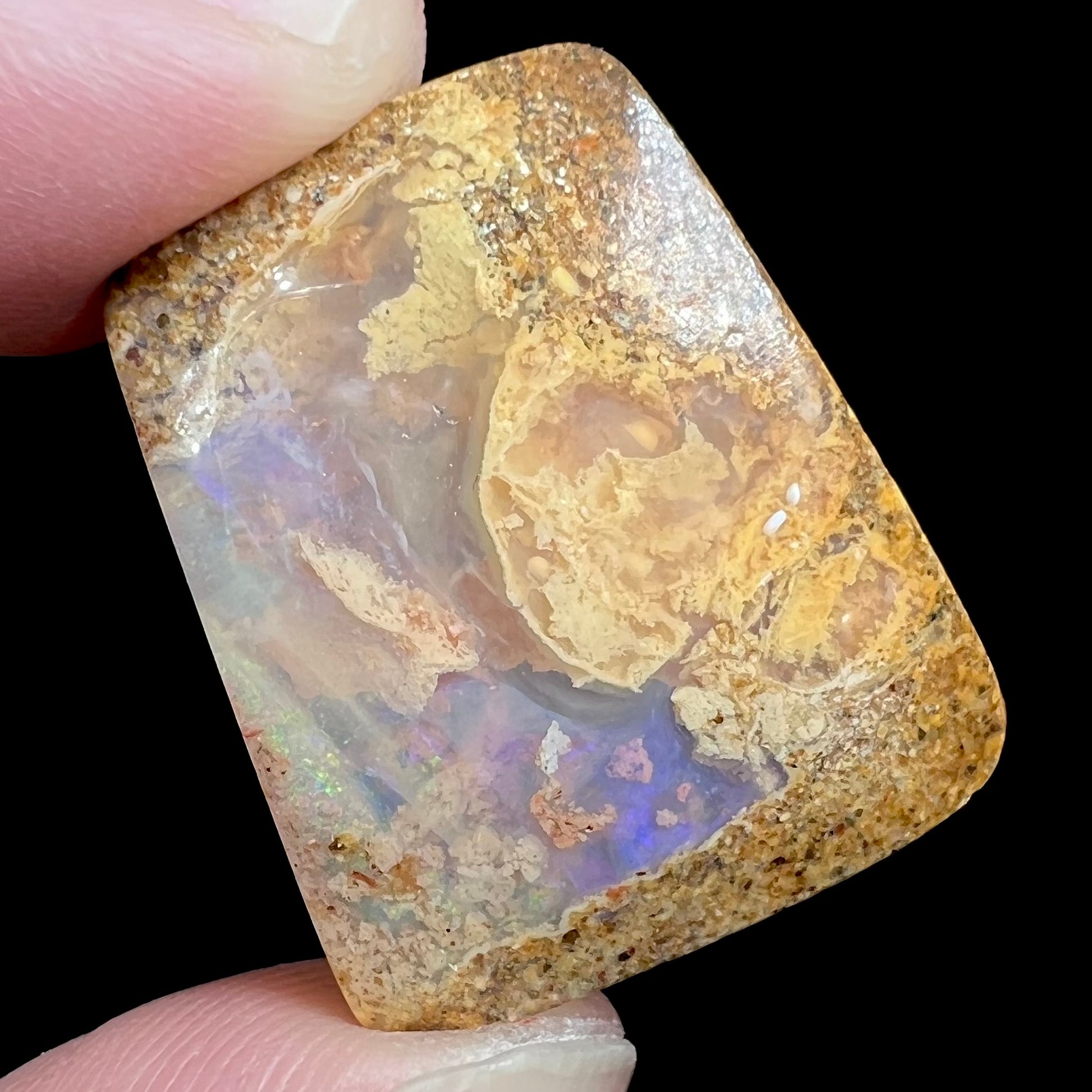 A polished, drilled pipe boulder opal bead.