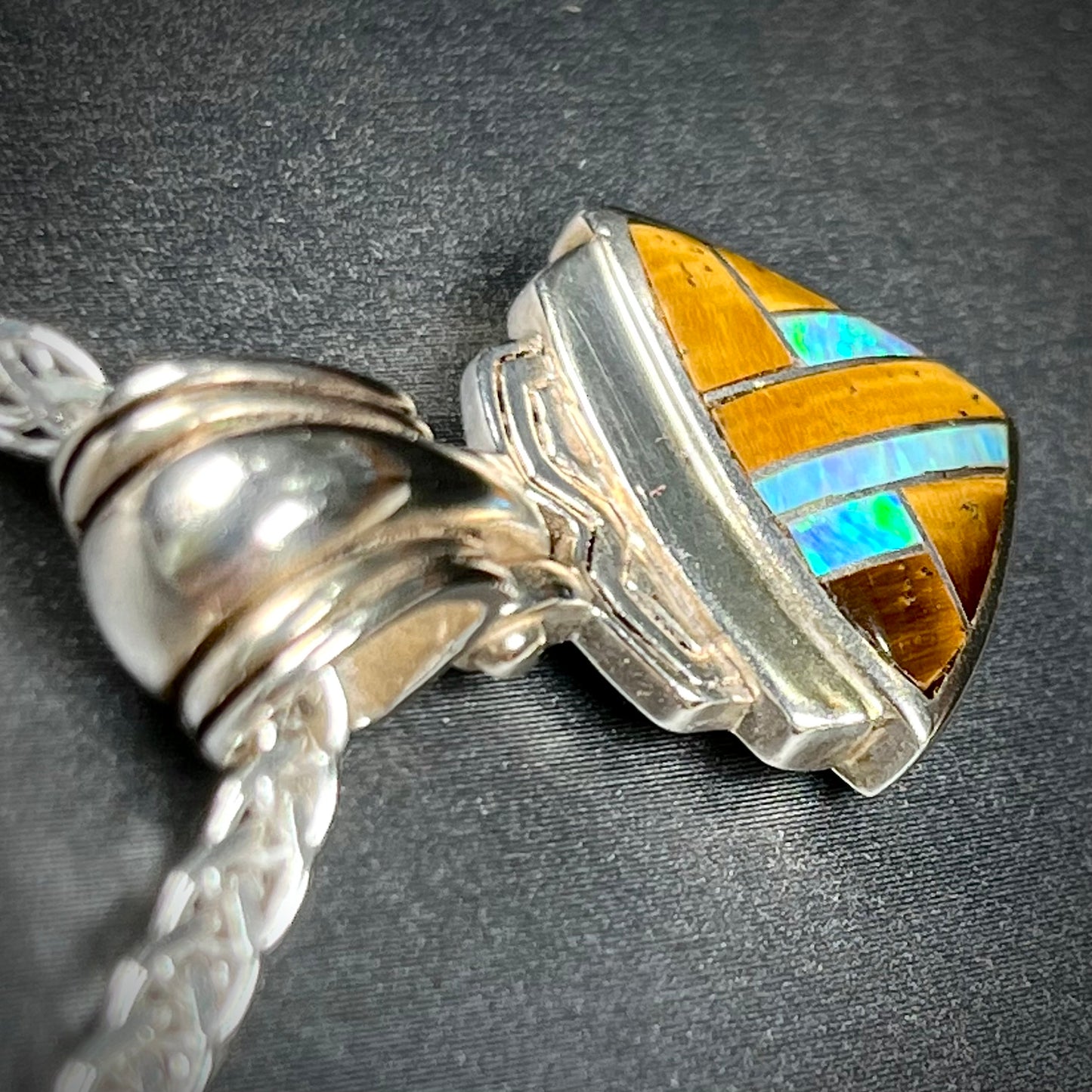 Tigers Eye and synthetic opal triangle inlay pendant set in sterling silver.