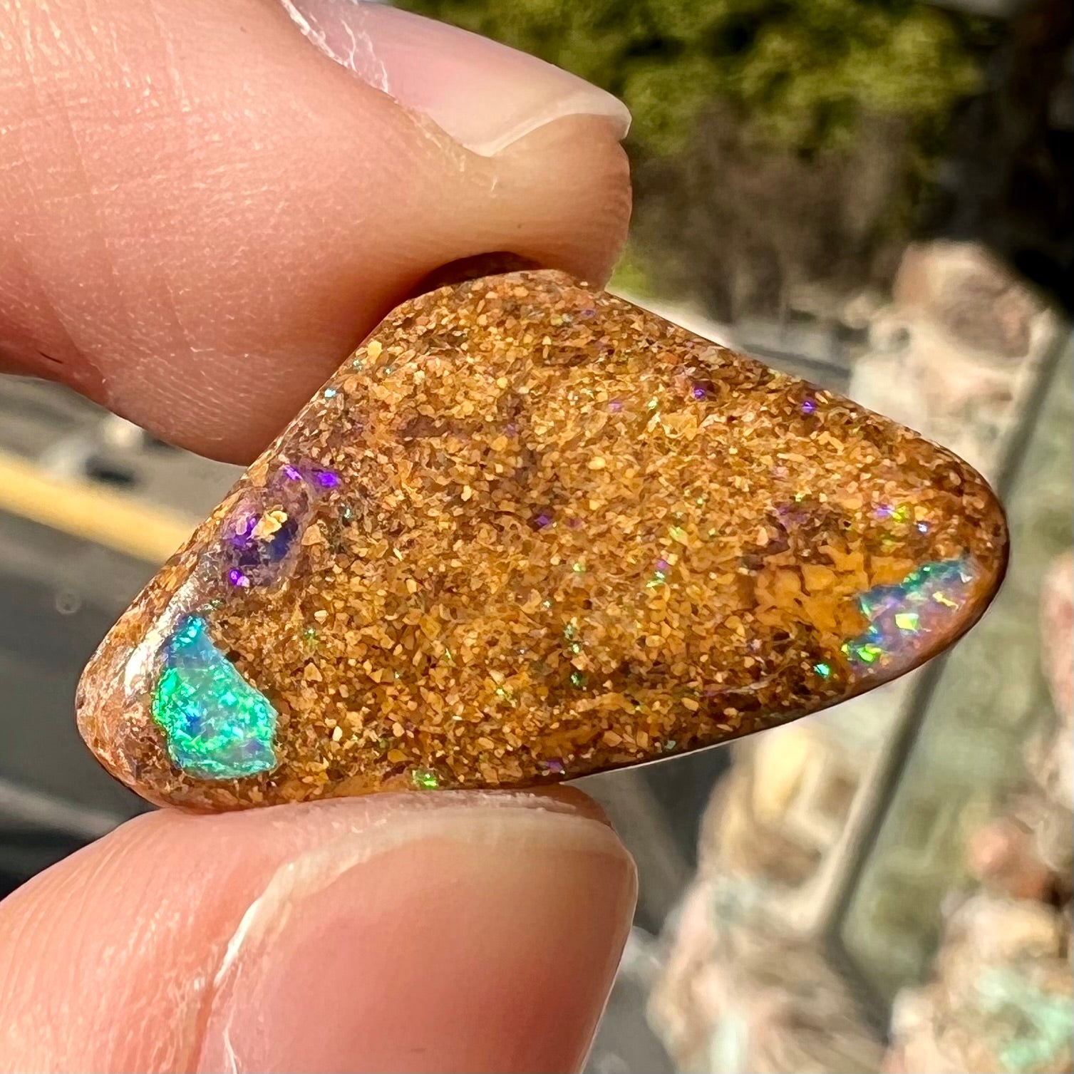 A polished, drilled pipe boulder opal bead.