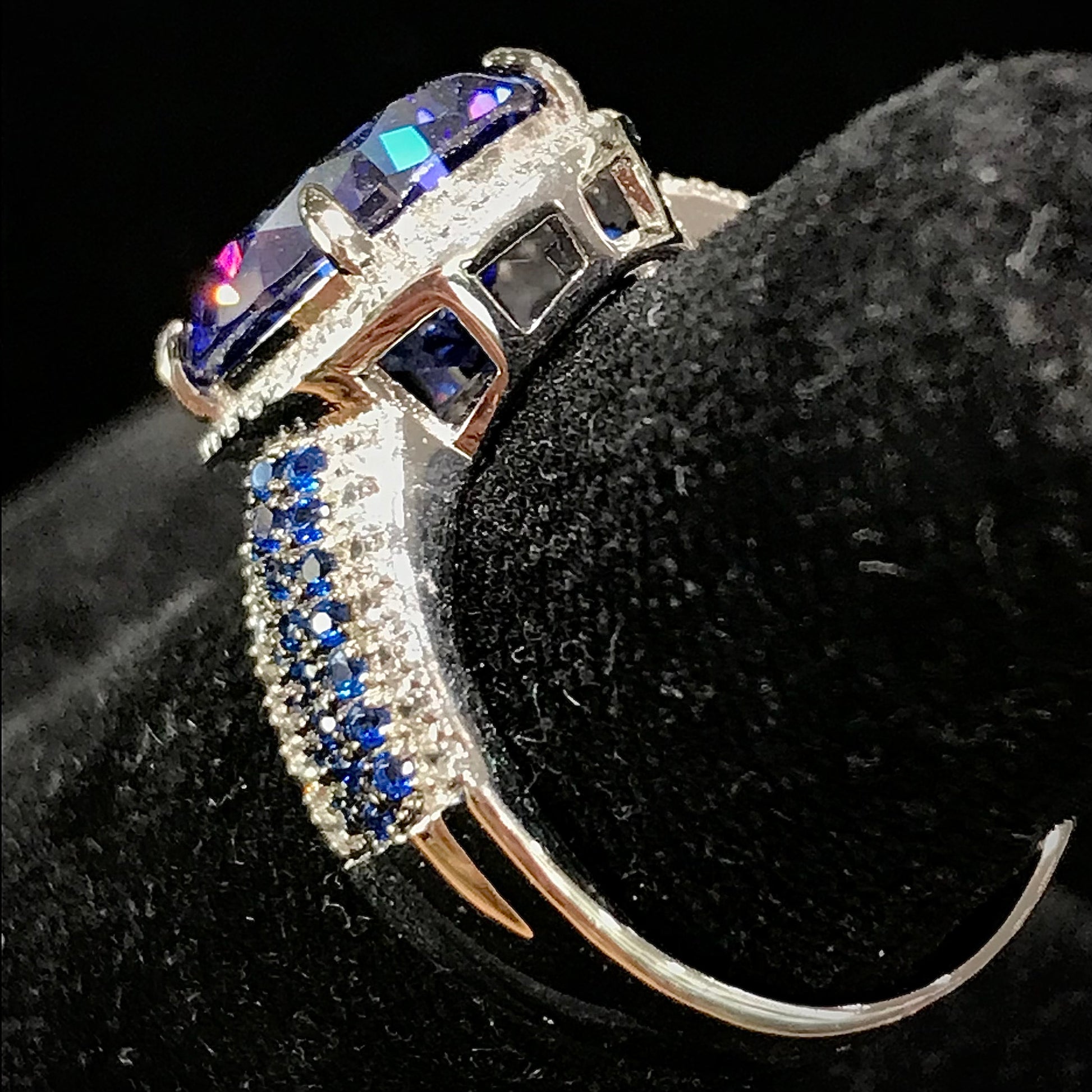 Synthetic blue and white gemstone ring prong set in sterling silver.