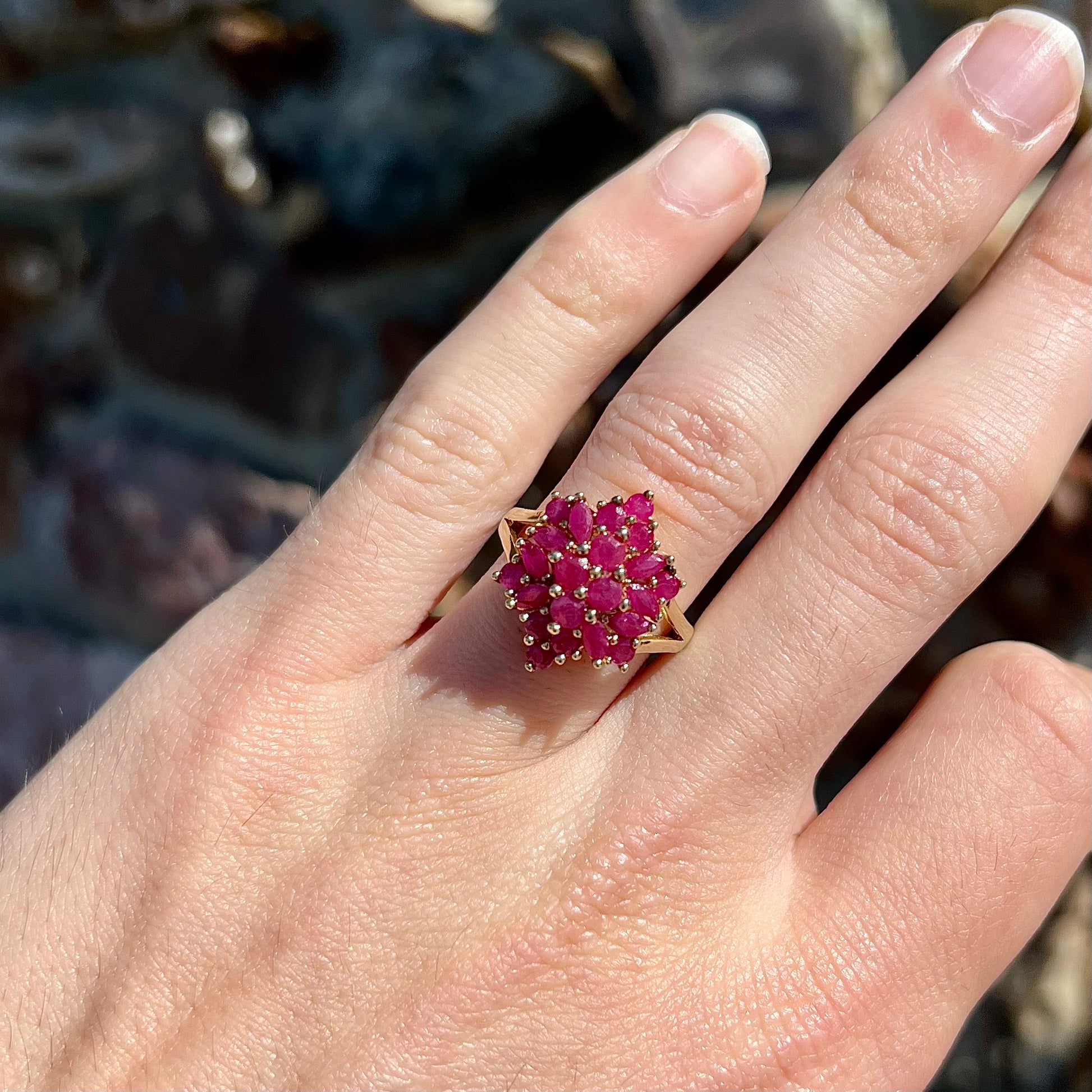 Burma ruby cluster ring set in 14 karat yellow gold.