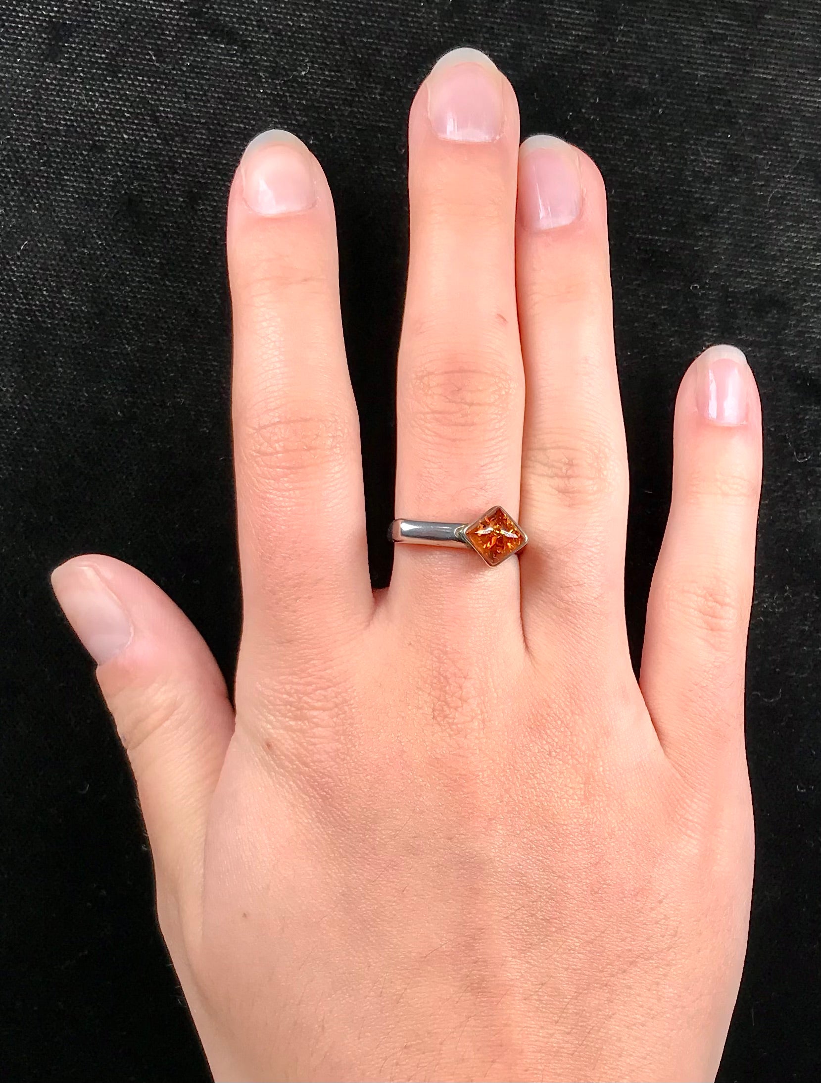Square shaped Baltic Amber cabochon set in a unique sterling silver ring.