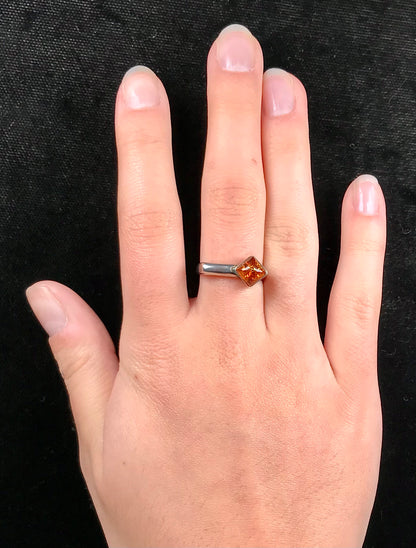 Square shaped Baltic Amber cabochon set in a unique sterling silver ring.