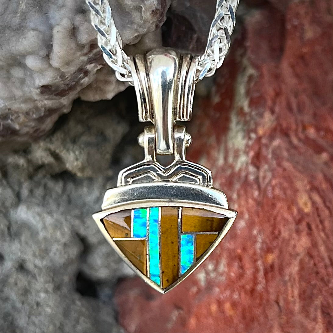 Tigers Eye and synthetic opal triangle inlay pendant set in sterling silver.