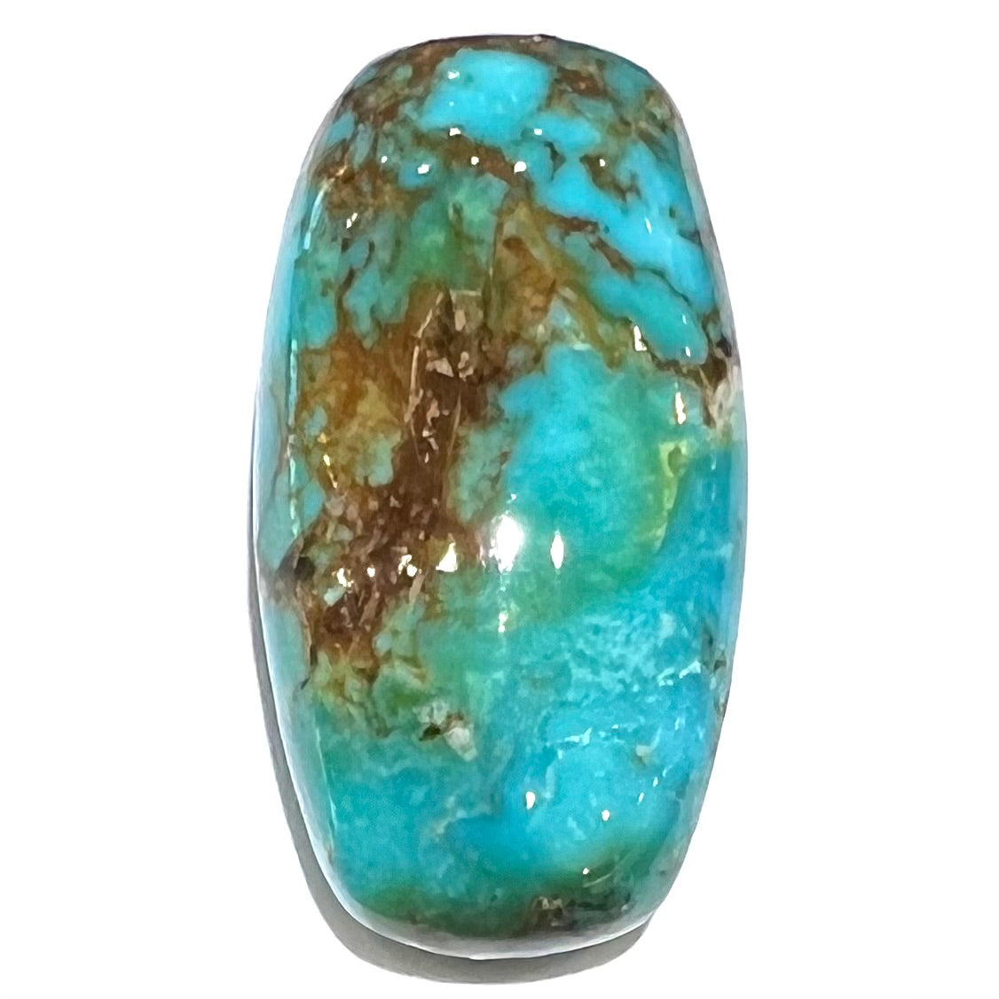 A loose, polished cabochon cut turquoise stone from Royston Mining District, Nevada.