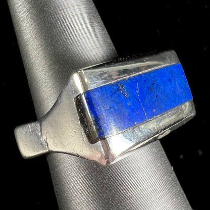 A sterling silver ring inlaid with a piece of lapis lazuli.  A small crack runs through the piece of lapis.