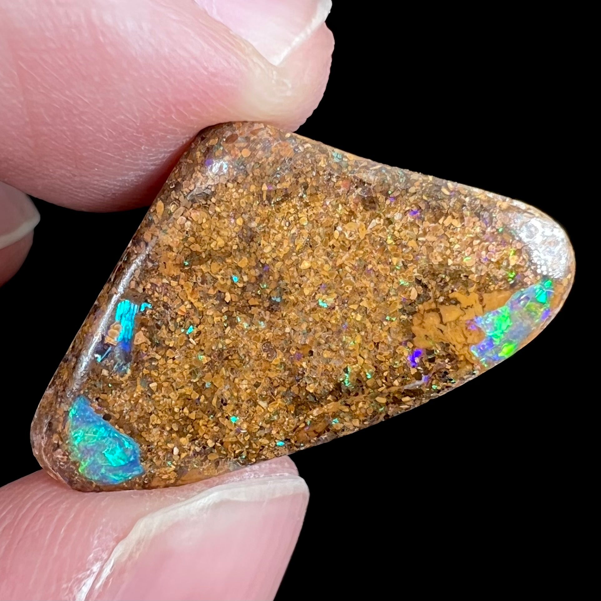A polished, drilled pipe boulder opal bead.