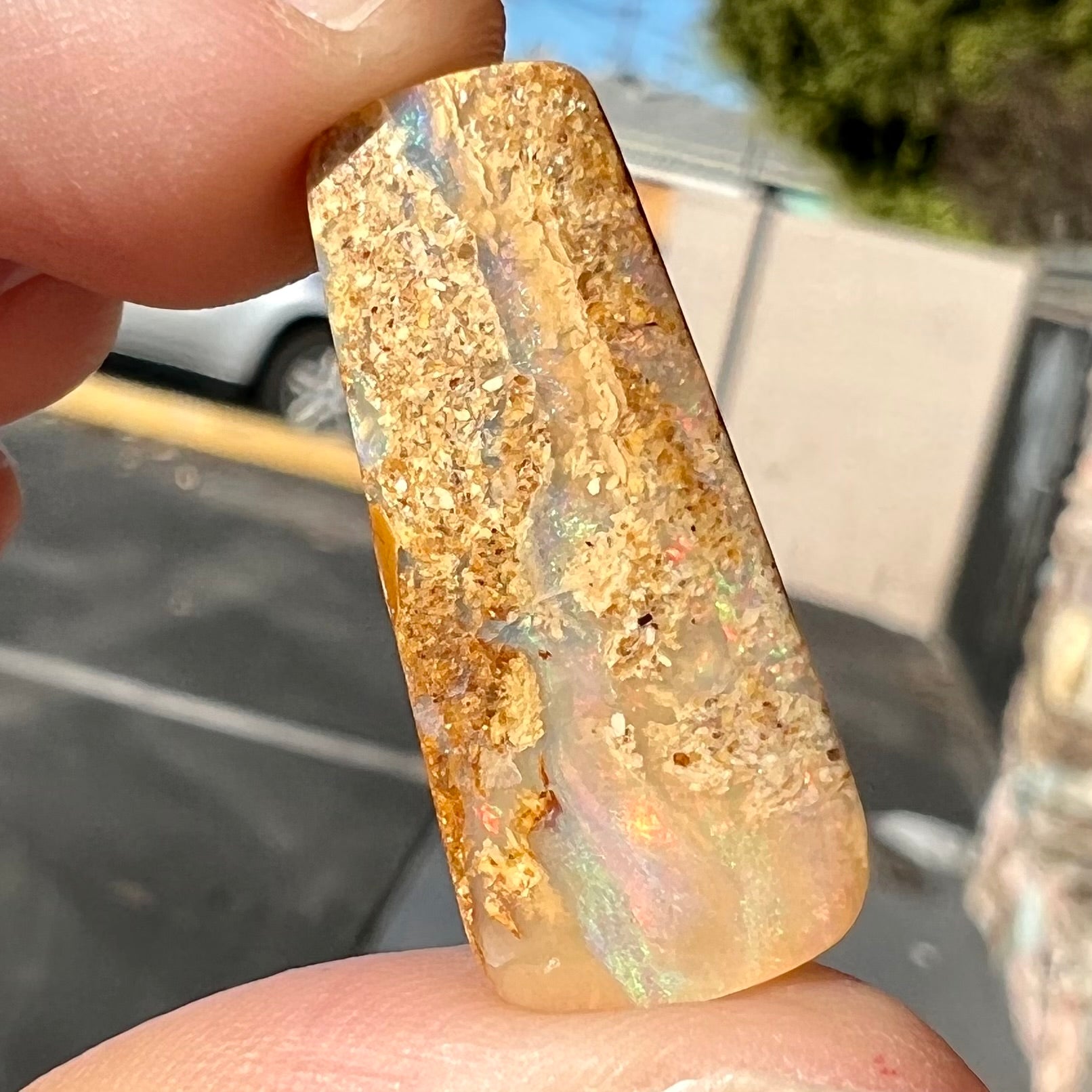 A polished, drilled pipe boulder opal bead.