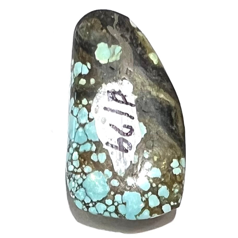 A loose, freeform cabochon cut turquoise stone from Number 8 Mine, Nevada.