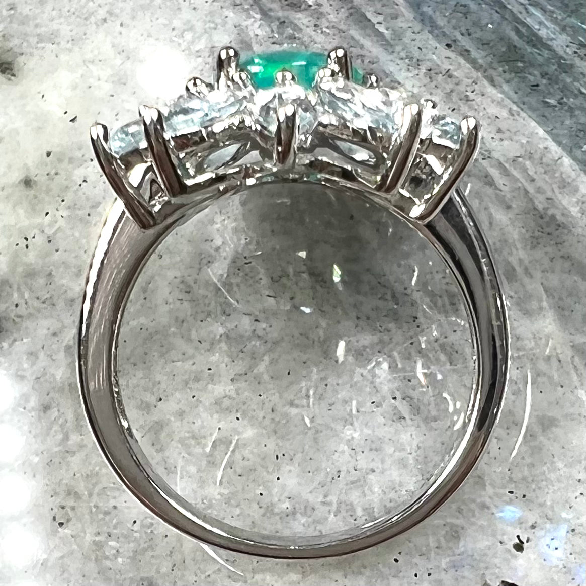 A faceted oval cut blue Ethiopian fire opal set in a sterling silver ring with marquise cut blue topaz stones.
