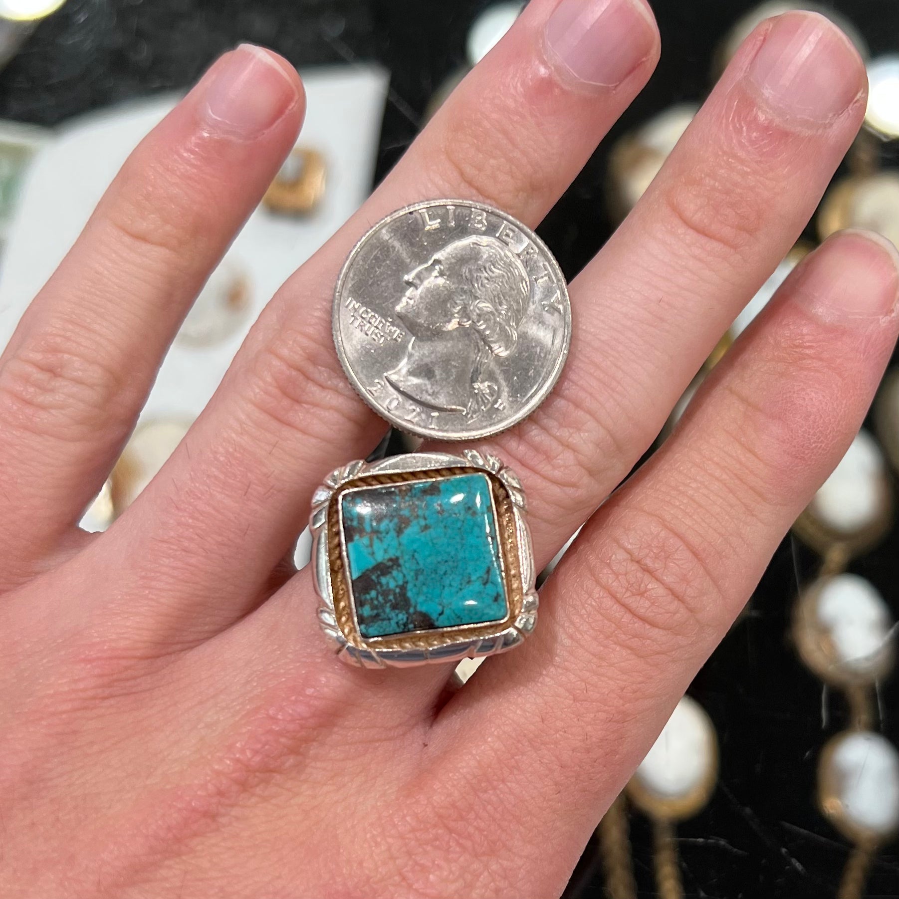 A handmade sterling silver, unisex, likely Navajo ring set with Tibetan turquoise.