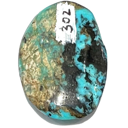 An oval cabochon cut Valley Blue turquoise stone.