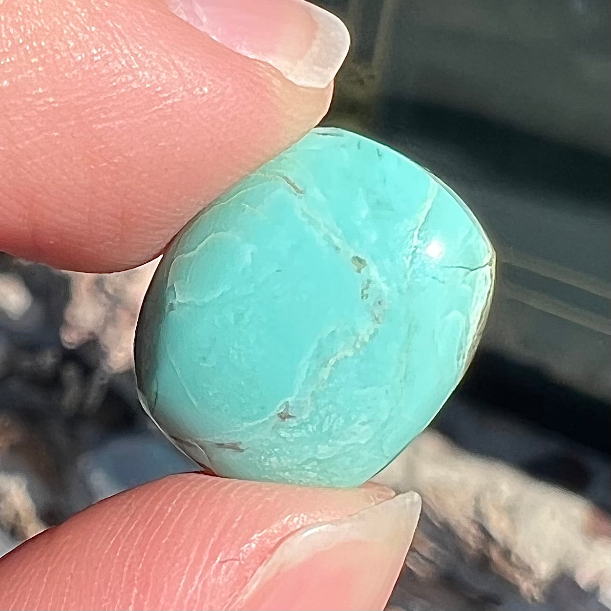 Loose cabochon cut Sleeping Beauty turquoise stone.