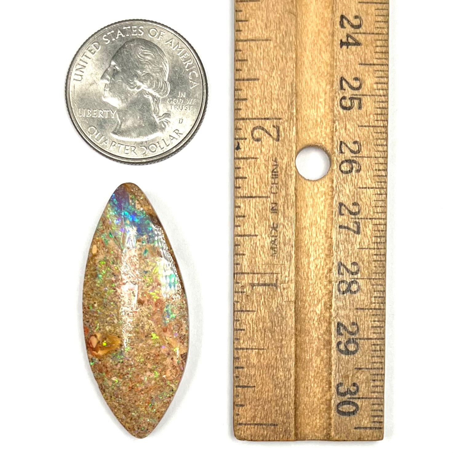 A polished, drilled pipe boulder opal bead.