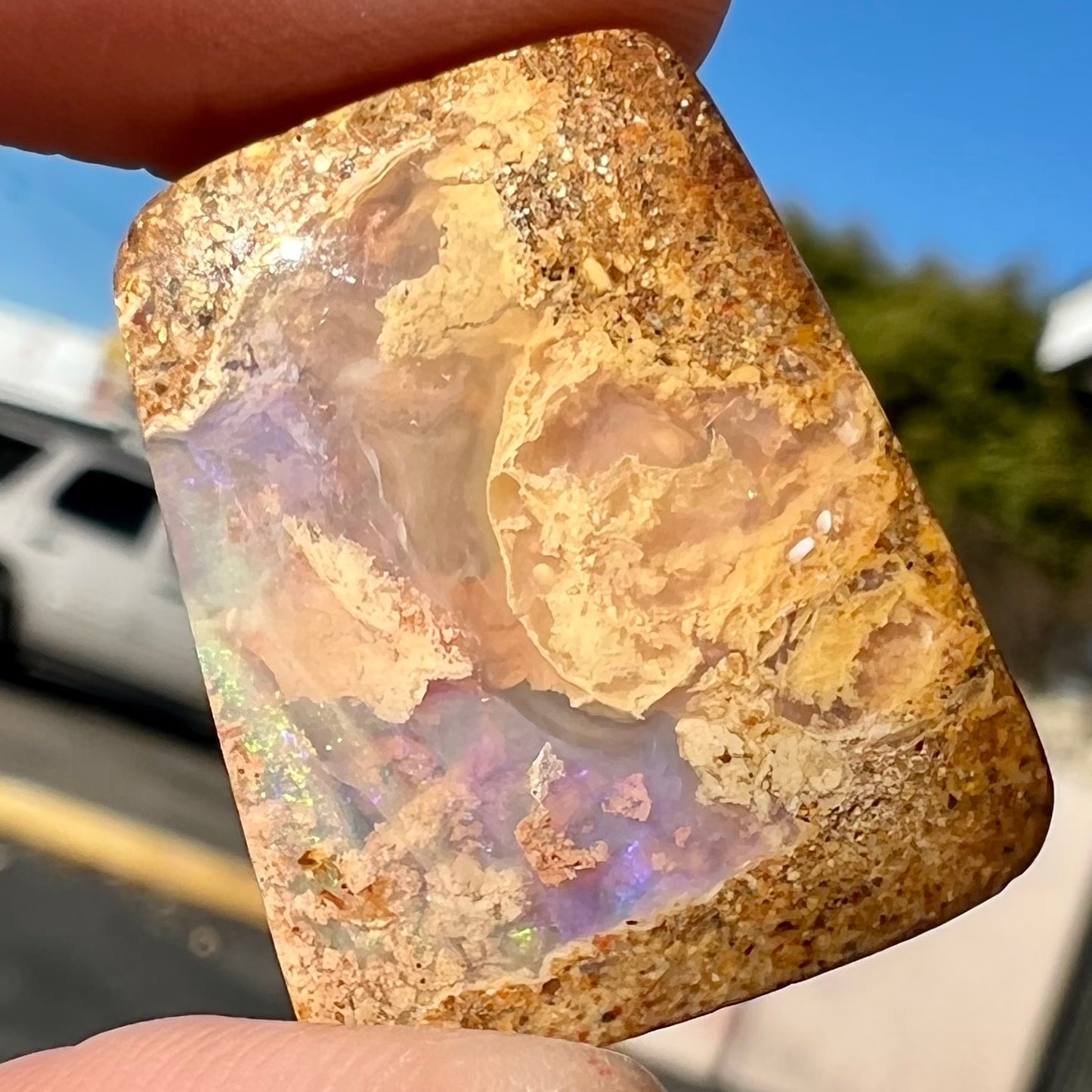 A polished, drilled pipe boulder opal bead.