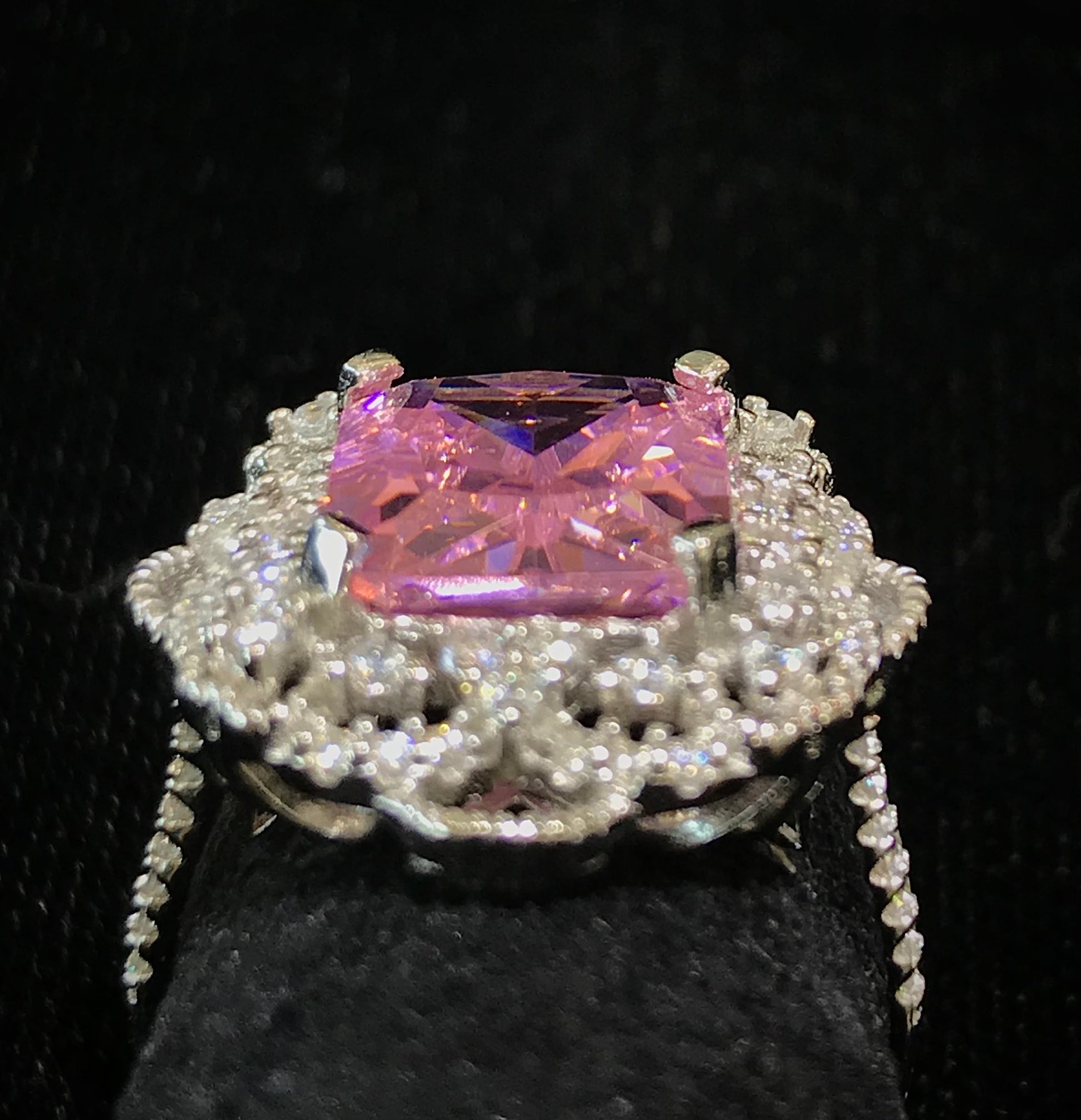 Pink synthetic gemstone ring set in sterling silver.