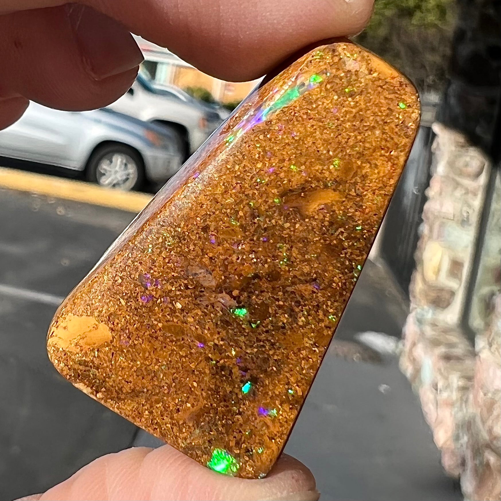 A polished, drilled pipe boulder opal bead.