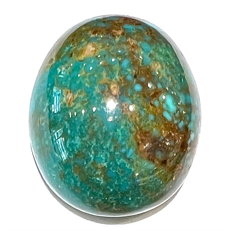 An oval cabochon cut green Royston turquoise with brown matrix.