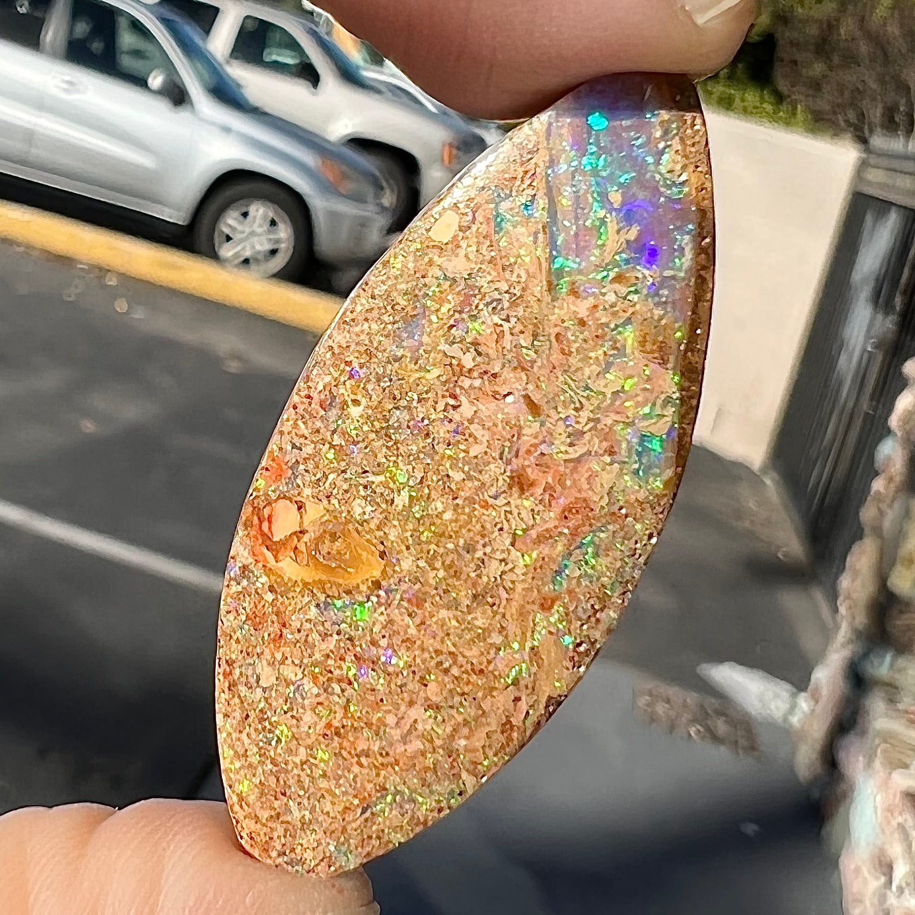 A polished, drilled pipe boulder opal bead.