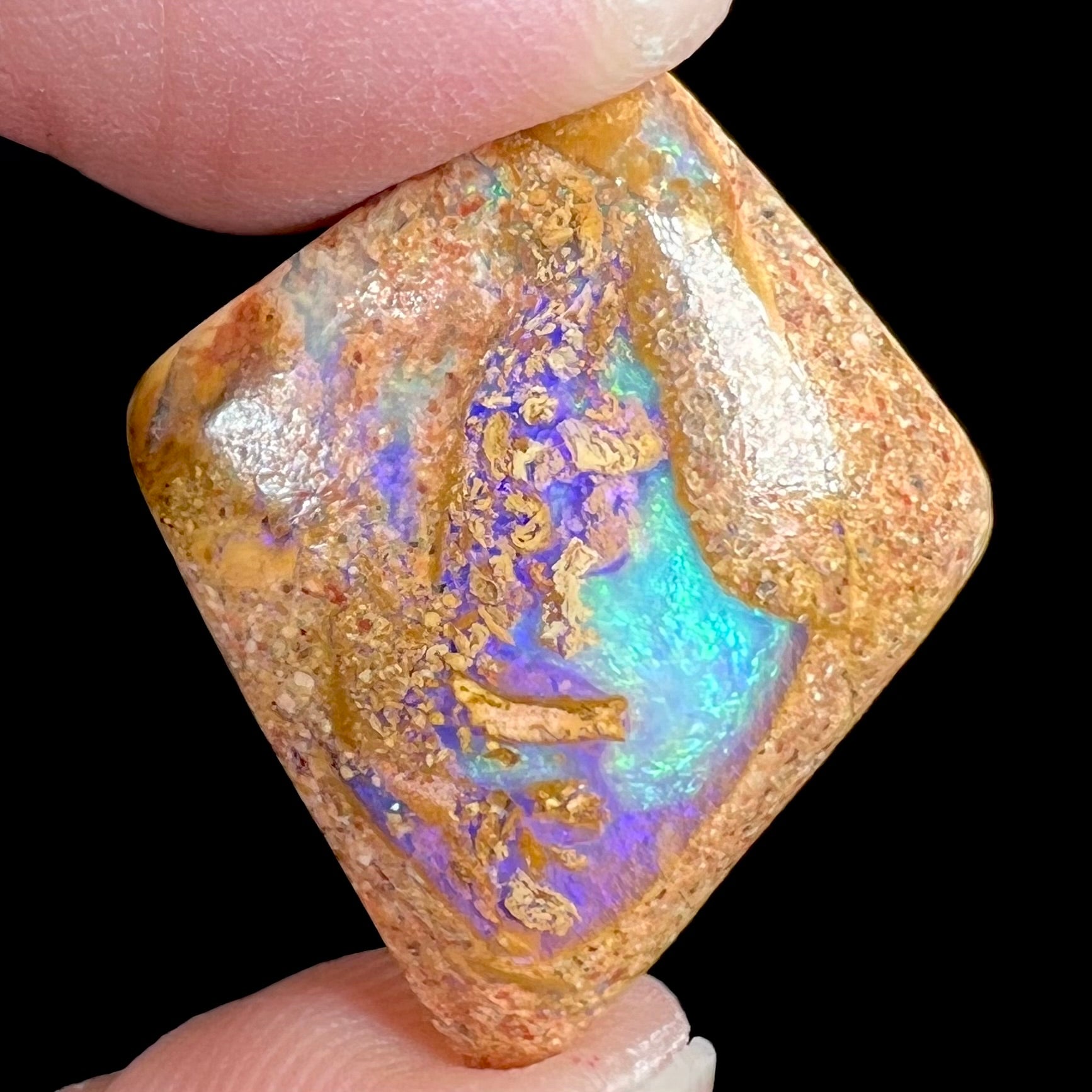 A polished, drilled pipe boulder opal bead.