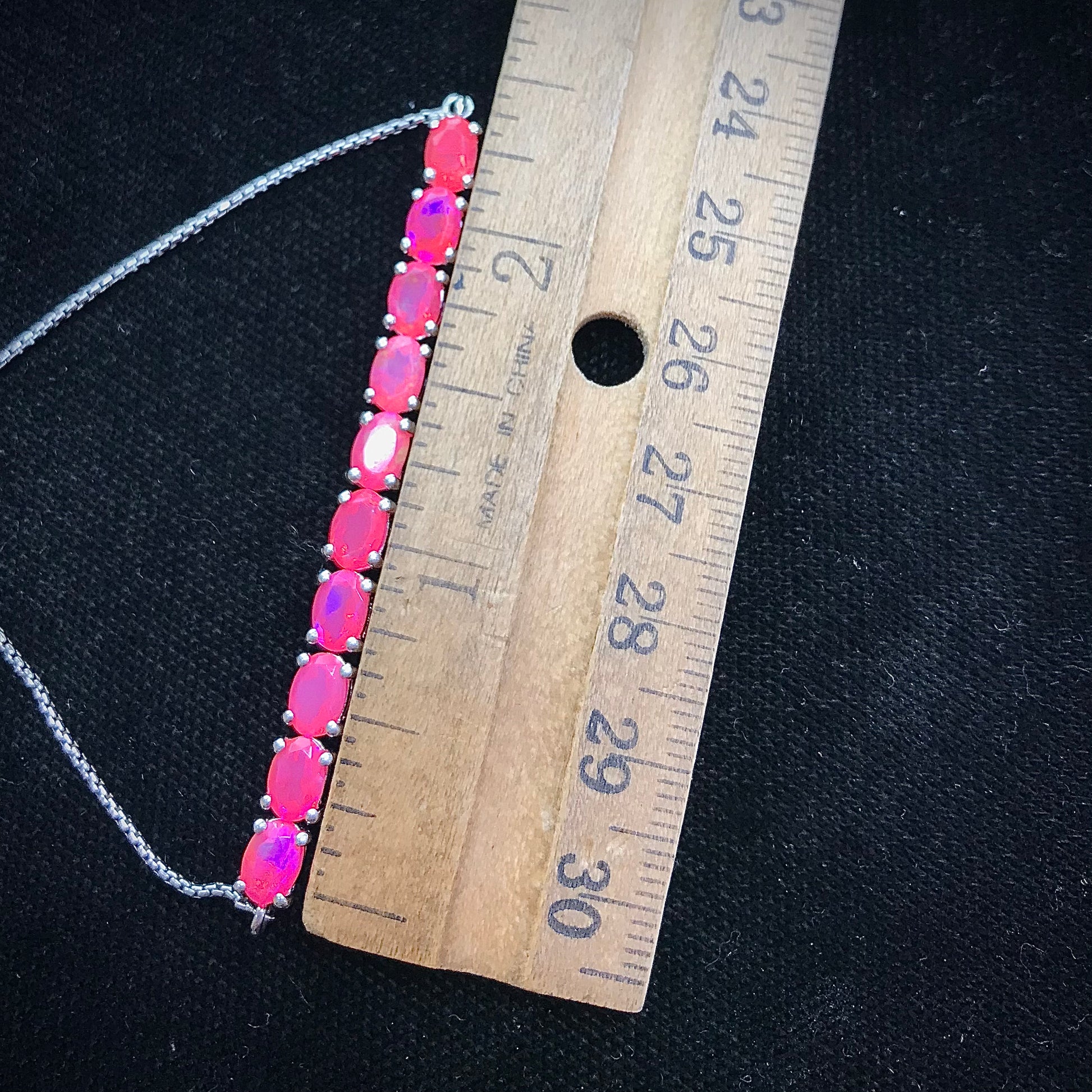 Pink dyed opal adjustable bracelet prong set in sterling silver.