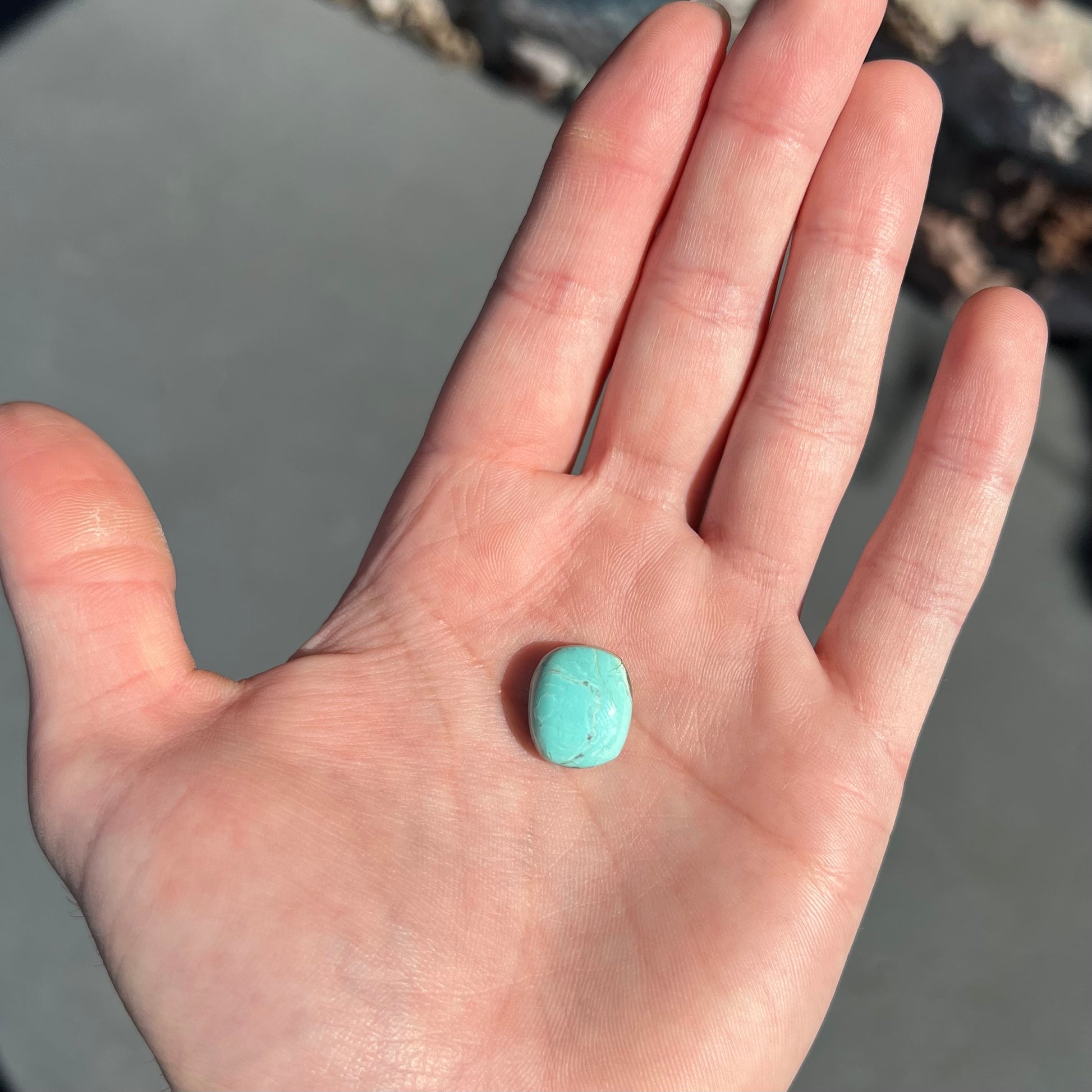 Loose cabochon cut Sleeping Beauty turquoise stone.