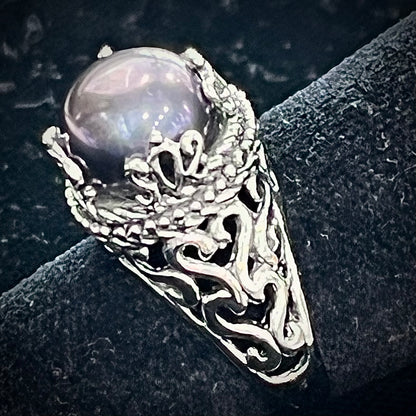 A vintage style sterling silver black pearl filigree ring.