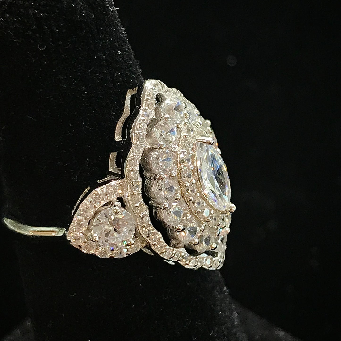 A sterling silver ring set with marquise cut white sapphire stones in sterling silver.