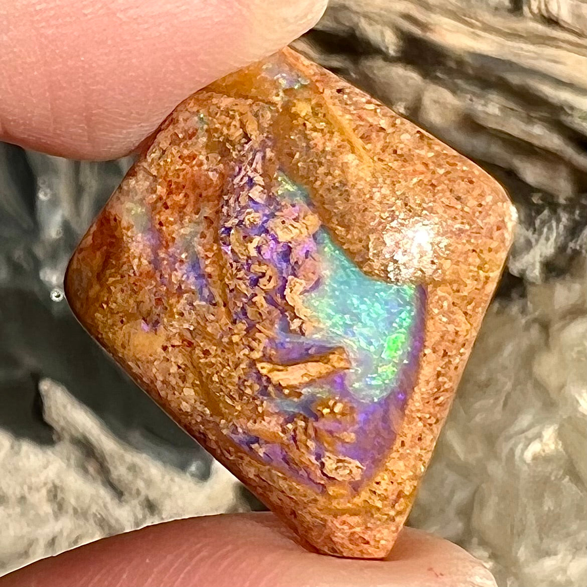 A polished, drilled pipe boulder opal bead.