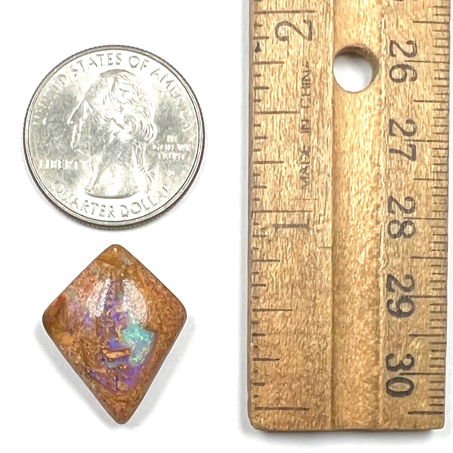 A polished, drilled pipe boulder opal bead.