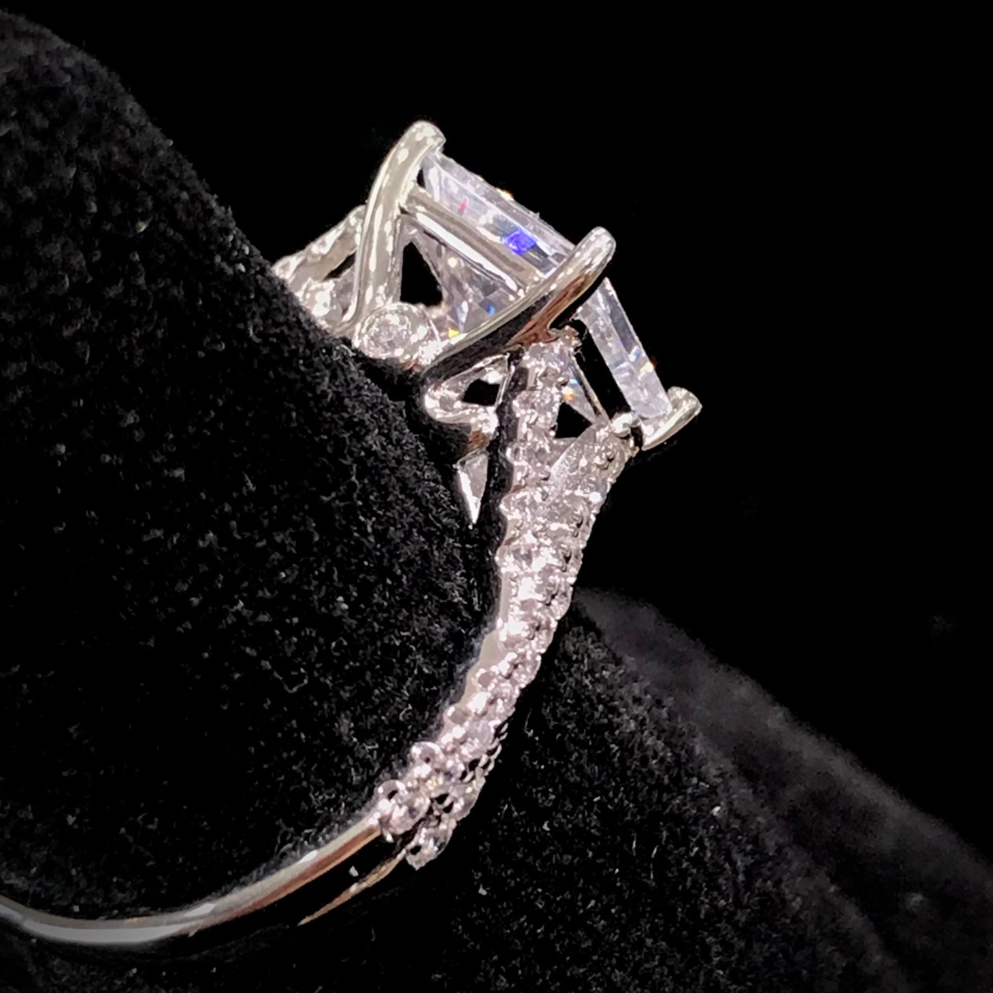 Women's cubic zirconia princess cut ring set in sterling silver with a twisted shank.