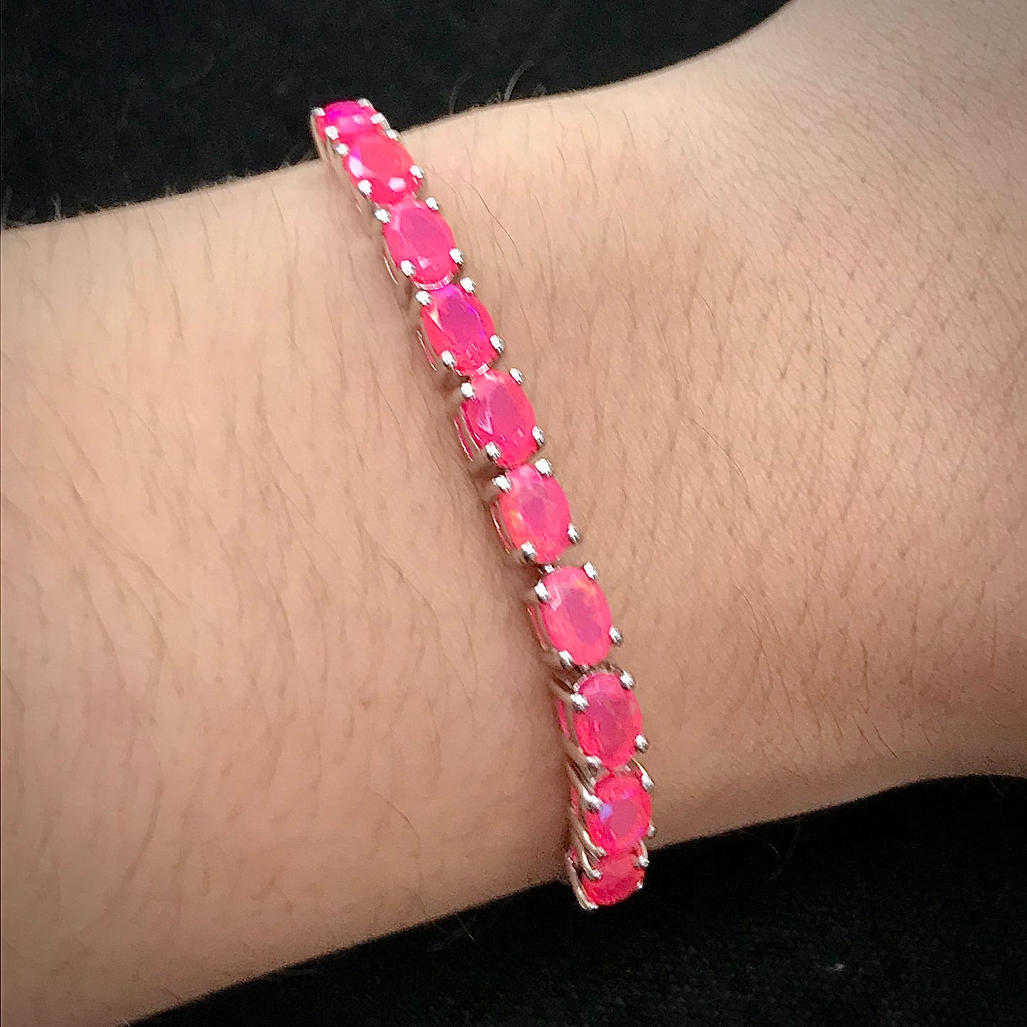 Pink dyed opal adjustable bracelet prong set in sterling silver.