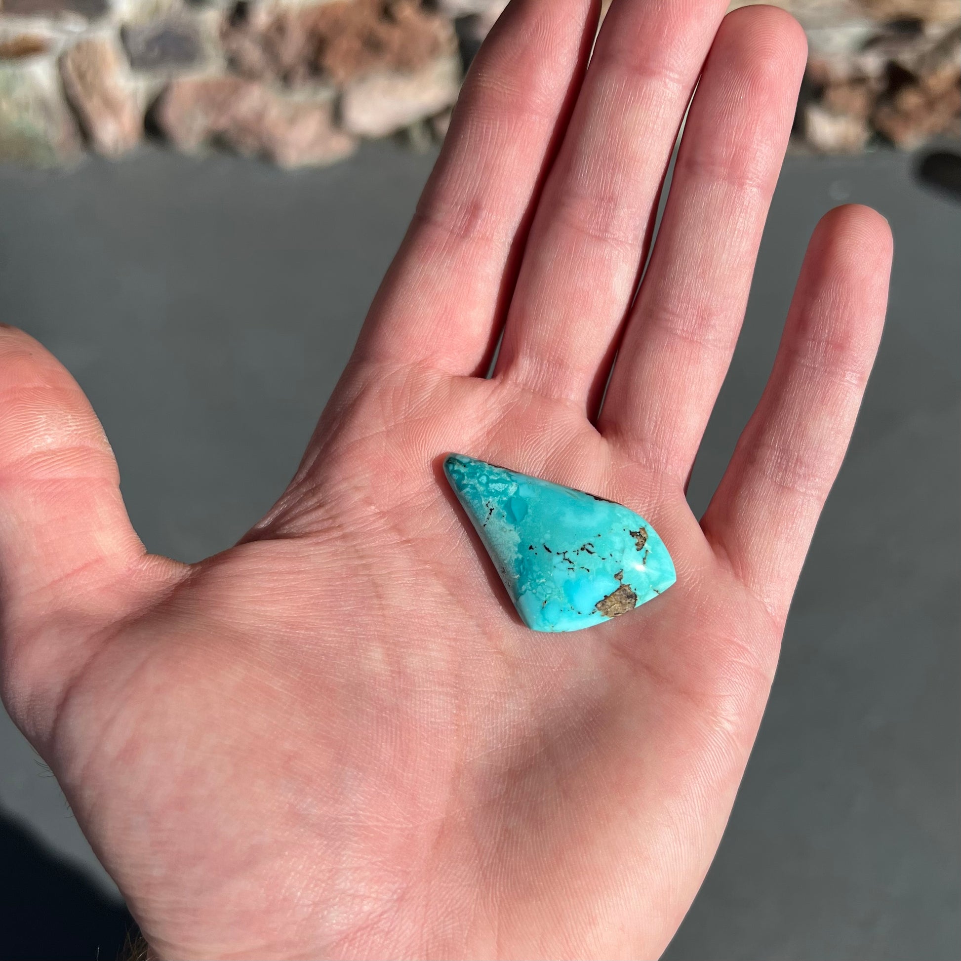 A loose, drop shape turquoise stone from the Sleeping Beauty Mine.